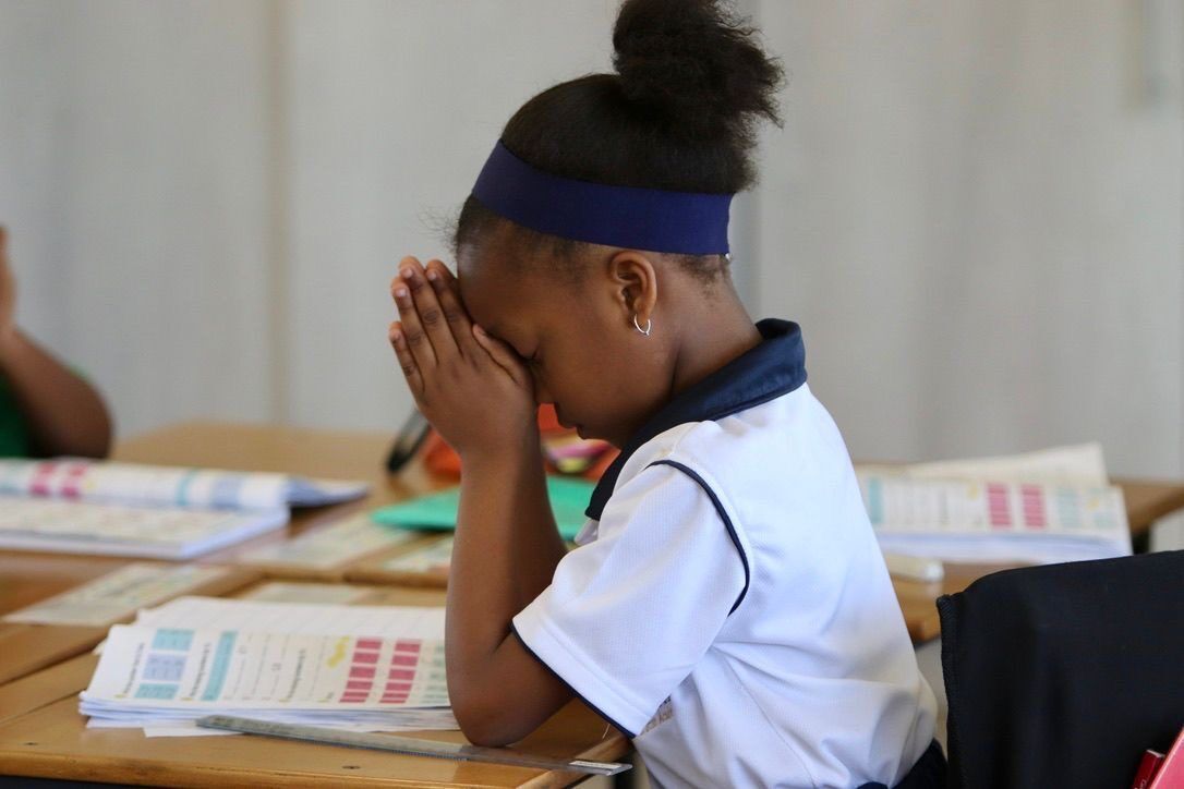 Primary pupil in quiet reflection